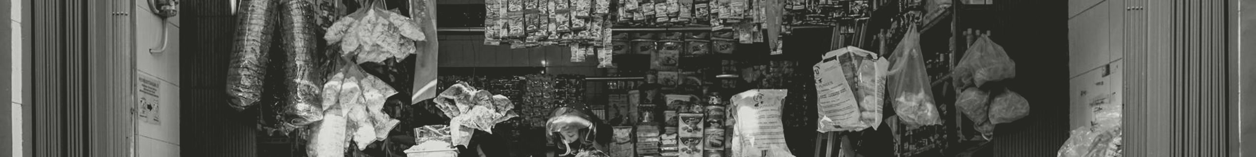 A small storefront stocked with goods and boxes